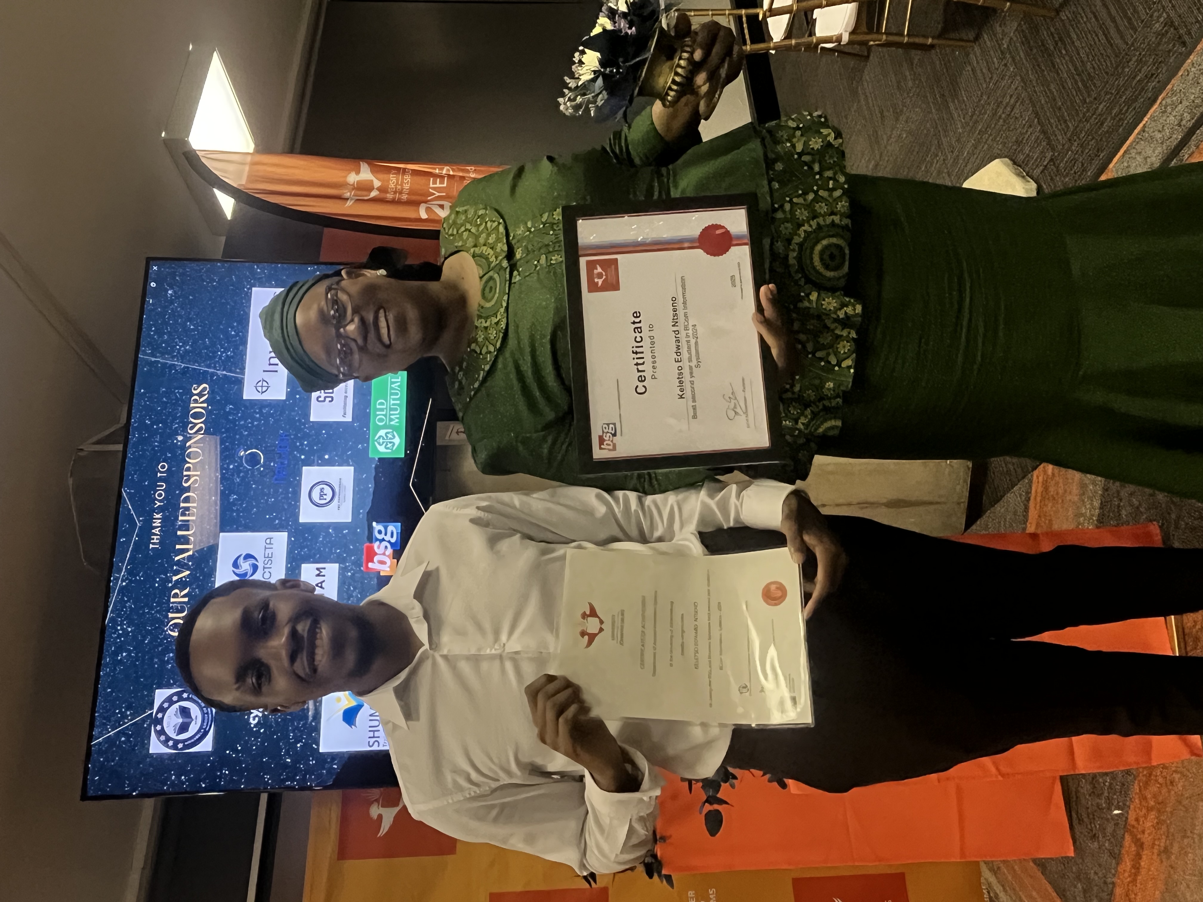 Professional awards ceremony with certificates of achievement